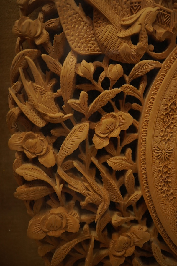 A pair of early 20th century, finely carved Chinese sandalwood photo frames, 30.5cmx24cm oval. Condition - good